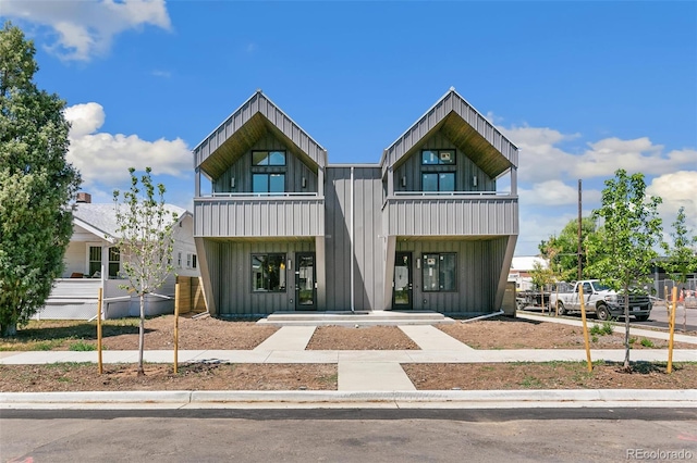 2403 S Cherokee St, Denver, CO 80223 - modern home featuring board and batten siding and a balcony