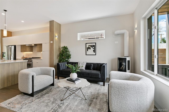 2403 S Cherokee St, Denver, CO 80223 - living area with a wood stove, recessed lighting, and light wood finished floors