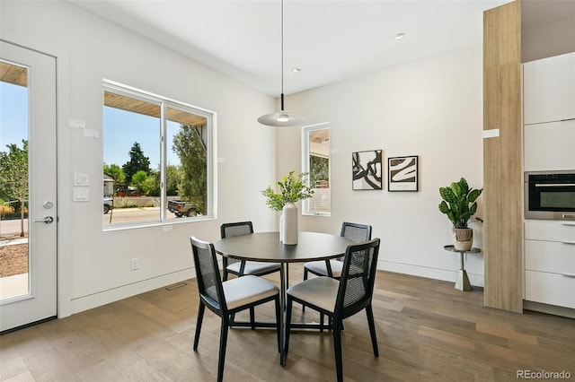 2403 S Cherokee St, Denver, CO 80223 - dining area with wood finished floors and recessed lighting