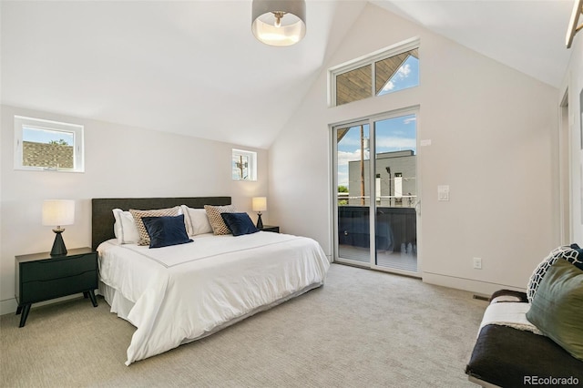 2403 S Cherokee St, Denver, CO 80223 - bedroom featuring access to exterior, light colored carpet, multiple windows, and high vaulted ceiling