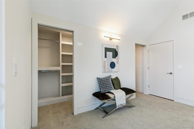 2403 S Cherokee St, Denver, CO 80223 - sitting room with carpet floors and vaulted ceiling