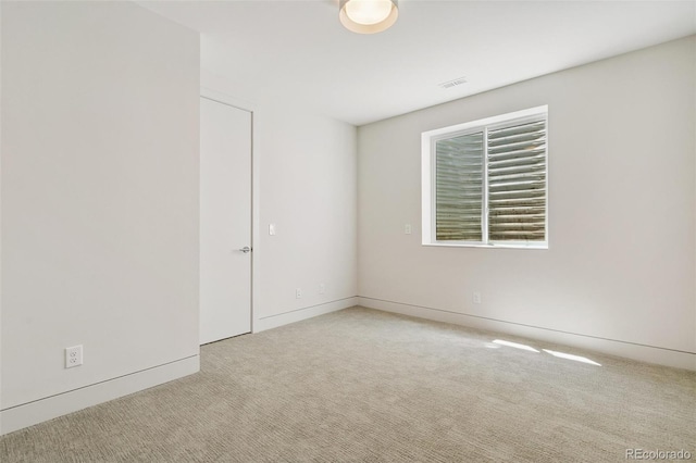 2403 S Cherokee St, Denver, CO 80223 - carpeted spare room featuring baseboards