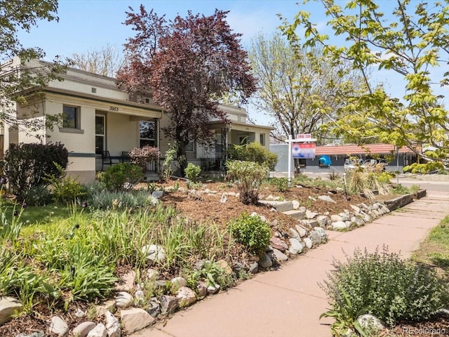 3953 Tejon St, Denver, CO 80211 - view of property hidden behind natural elements featuring brick siding