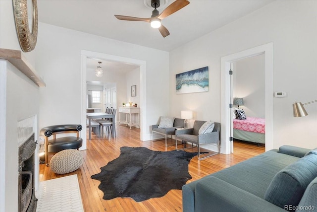3953 Tejon St, Denver, CO 80211 - living room with ceiling fan, a fireplace, and wood finished floors