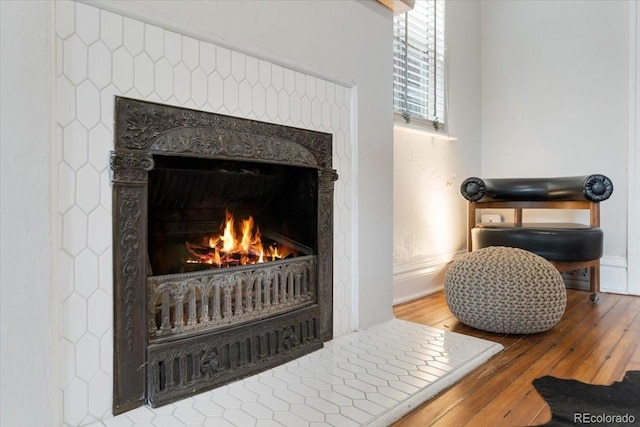3953 Tejon St, Denver, CO 80211 - detailed view of a warm lit fireplace and wood finished floors