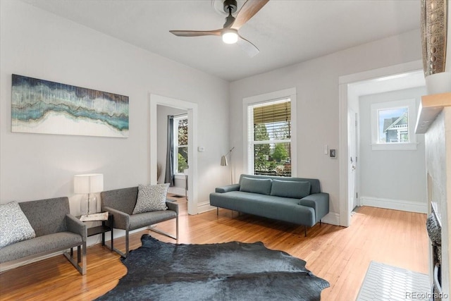 3953 Tejon St, Denver, CO 80211 - sitting room with light wood-style floors, ceiling fan, and baseboards