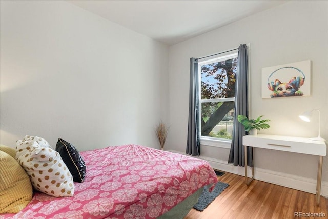 3953 Tejon St, Denver, CO 80211 - bedroom with multiple windows, wood finished floors, and baseboards