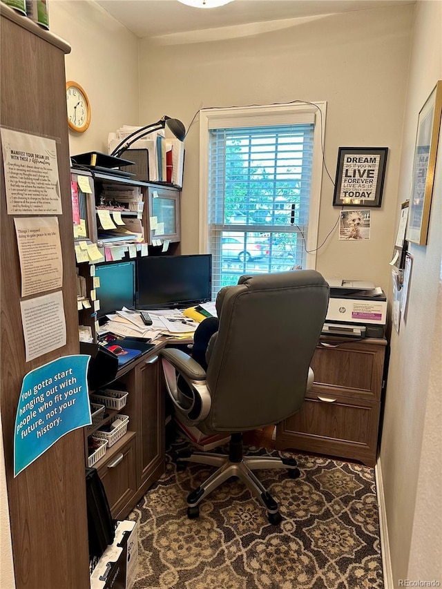 office space with baseboards