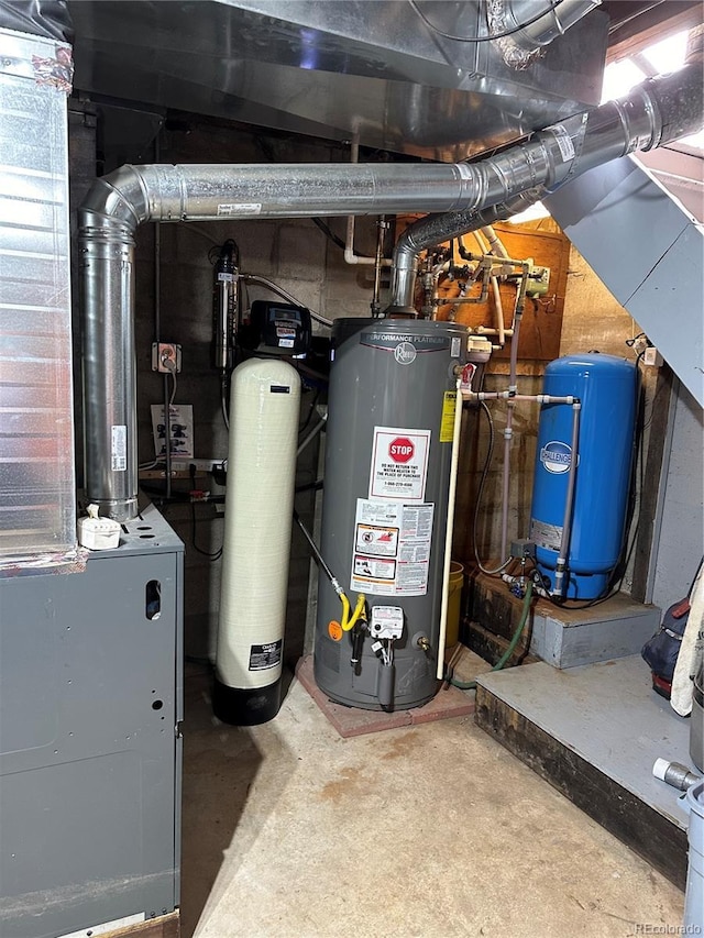 utility room featuring gas water heater