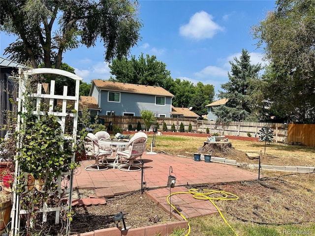exterior space featuring a fenced backyard and a patio area