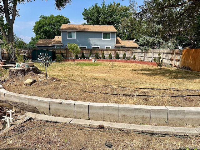 view of yard with a fenced backyard