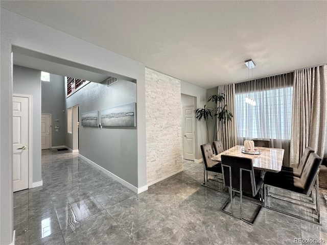dining room featuring baseboards