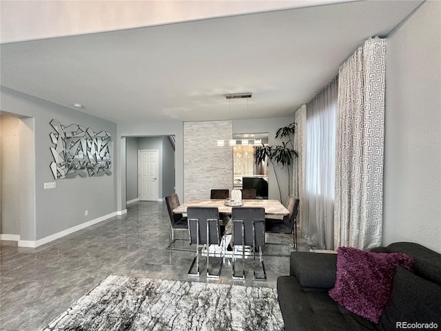 dining space with baseboards
