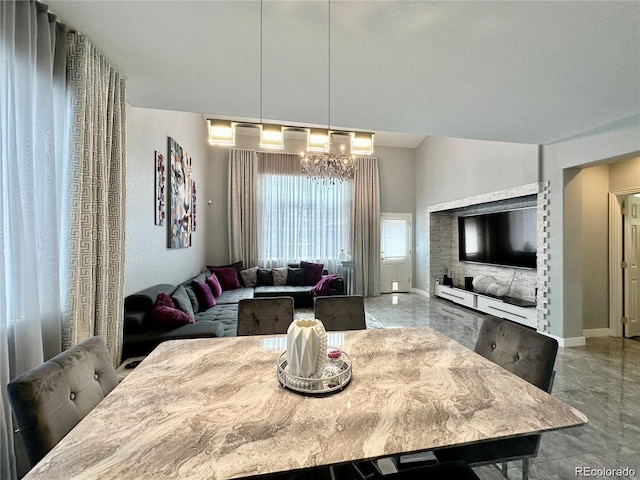 dining room featuring baseboards and an inviting chandelier