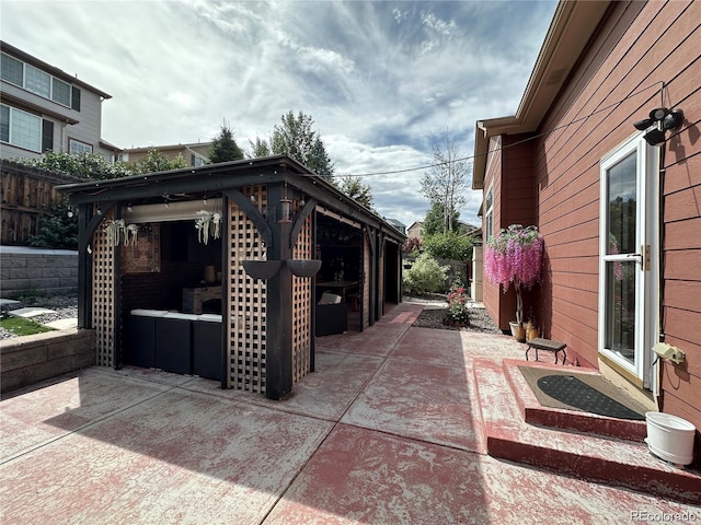 view of patio featuring fence