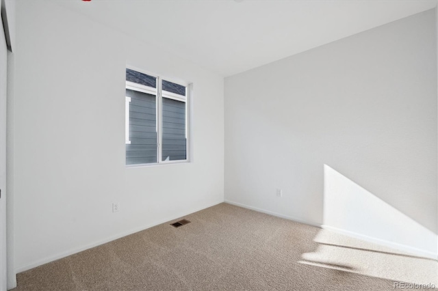 view of carpeted spare room