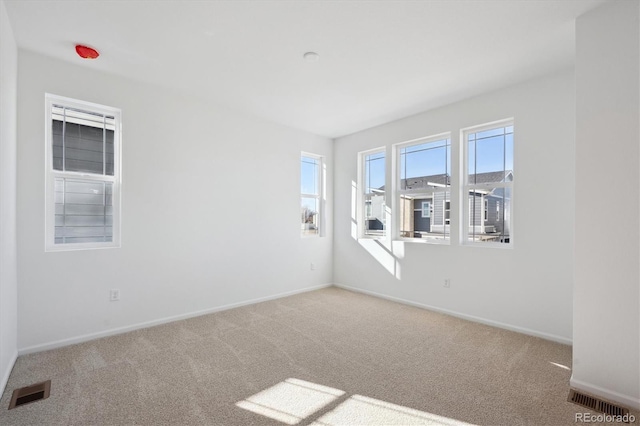 unfurnished room with carpet flooring