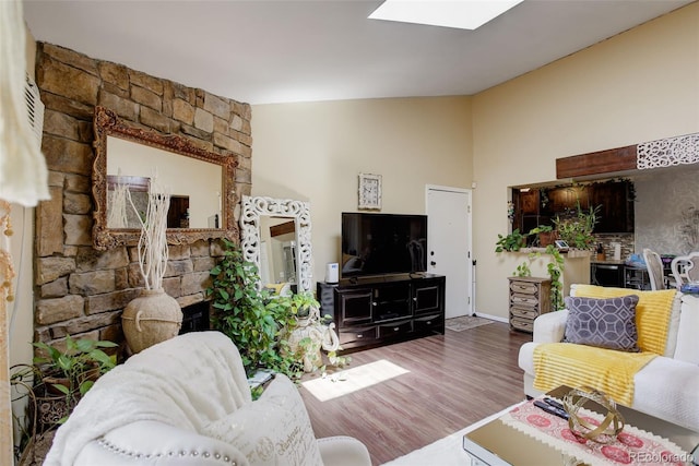 10150 E Virginia Ave Unit 18-302, Denver, CO 80247 - living area with wood finished floors and a skylight
