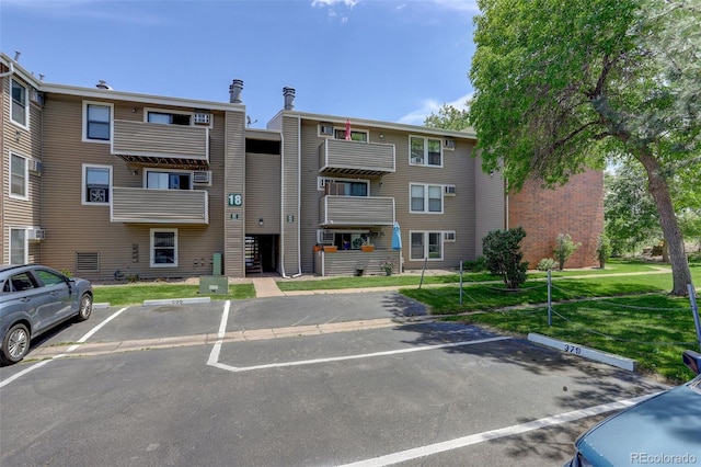 10150 E Virginia Ave Unit 18-302, Denver, CO 80247 - view of property with uncovered parking