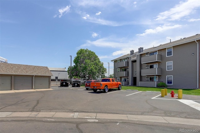 10150 E Virginia Ave Unit 18-302, Denver, CO 80247 - view of uncovered parking lot