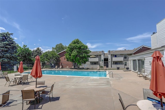 10150 E Virginia Ave Unit 18-302, Denver, CO 80247 - community pool featuring a patio area