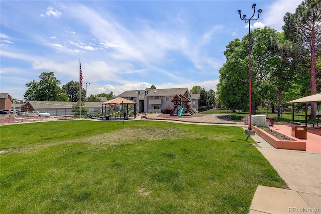 10150 E Virginia Ave Unit 18-302, Denver, CO 80247 - view of grassy yard with a gazebo