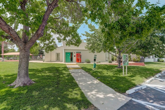 10150 E Virginia Ave Unit 18-302, Denver, CO 80247 - view of front of house featuring a front yard