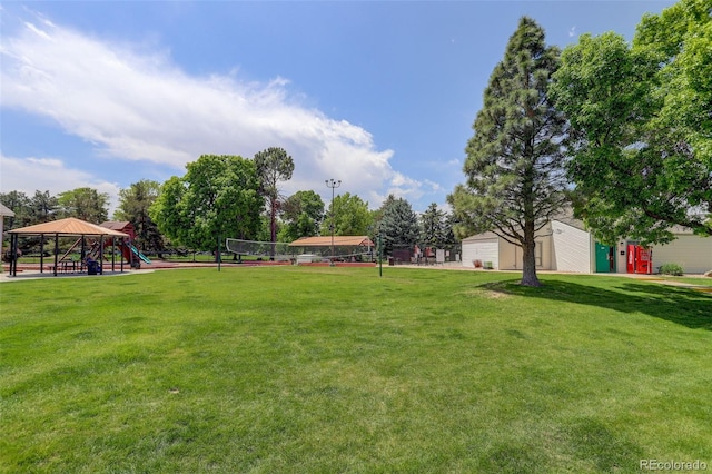 10150 E Virginia Ave Unit 18-302, Denver, CO 80247 - view of green lawn with volleyball court and a gazebo