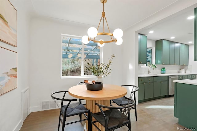 211 Newport St, Denver, CO 80220 - dining space with a chandelier, recessed lighting, and baseboards