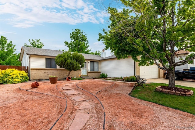 4520 E 112th Pl, Thornton, CO 80233 - ranch-style home featuring brick siding, concrete driveway, a chimney, and a garage