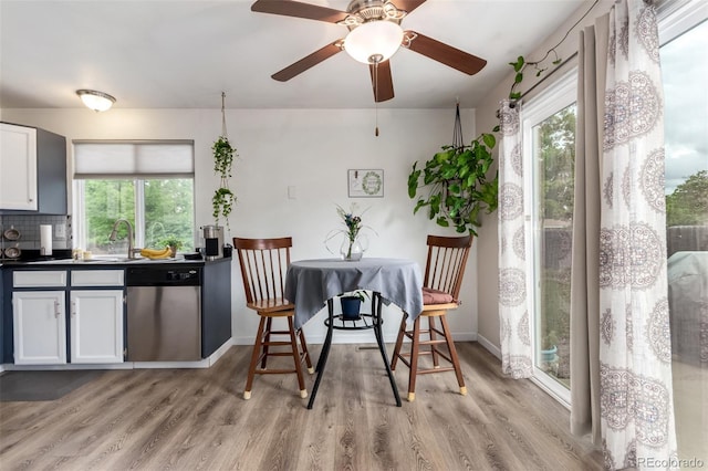 4520 E 112th Pl, Thornton, CO 80233 - dining area with healthy amount of natural light, light wood finished floors, baseboards, and ceiling fan