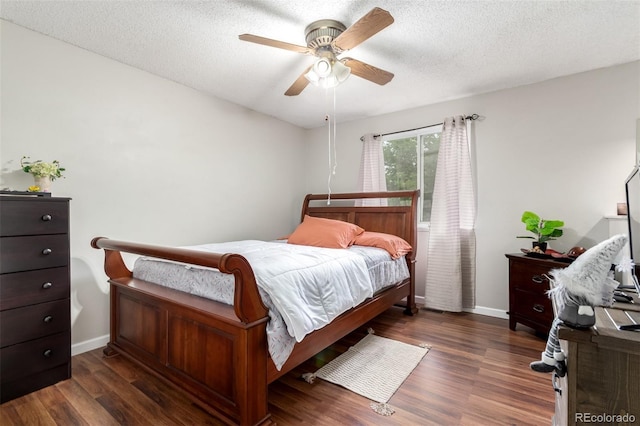 4520 E 112th Pl, Thornton, CO 80233 - bedroom with wood finished floors, a textured ceiling, a ceiling fan, and baseboards