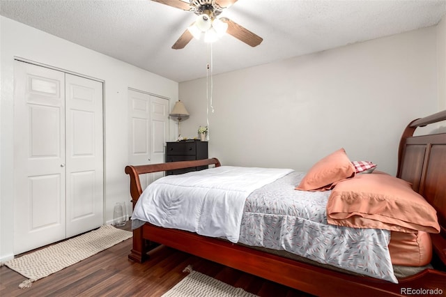 4520 E 112th Pl, Thornton, CO 80233 - bedroom featuring wood finished floors, multiple closets, and a ceiling fan