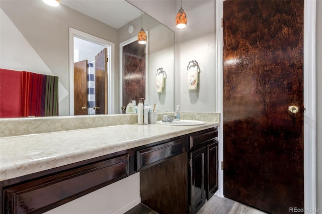 4520 E 112th Pl, Thornton, CO 80233 - bathroom featuring vanity and wood finished floors