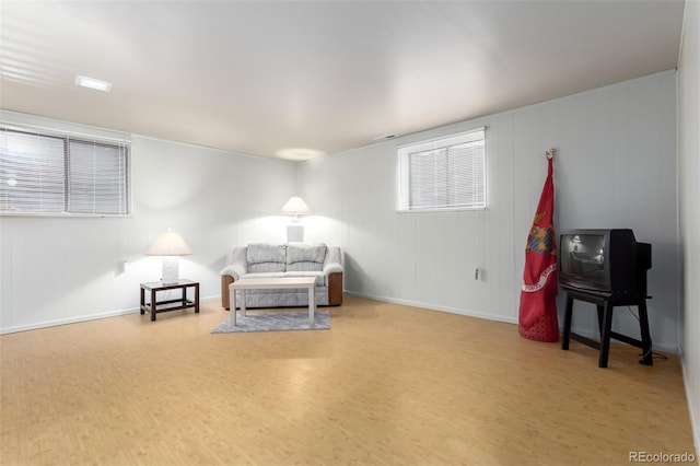 4520 E 112th Pl, Thornton, CO 80233 - living area featuring wood finished floors, baseboards, and a decorative wall