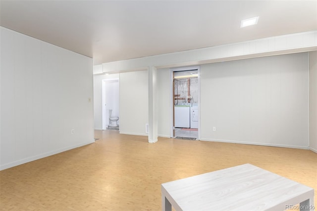 4520 E 112th Pl, Thornton, CO 80233 - spare room with independent washer and dryer, light wood-type flooring, and baseboards