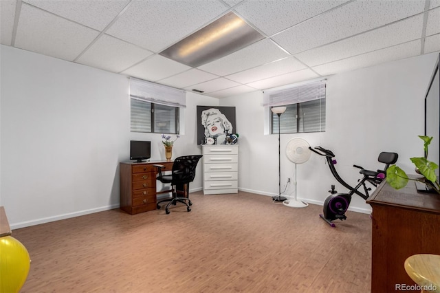 4520 E 112th Pl, Thornton, CO 80233 - home office featuring a paneled ceiling, wood finished floors, and baseboards