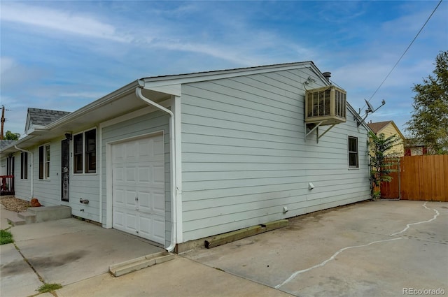 view of side of property featuring a garage