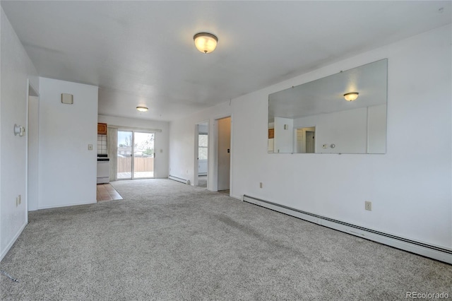 carpeted empty room with a baseboard radiator