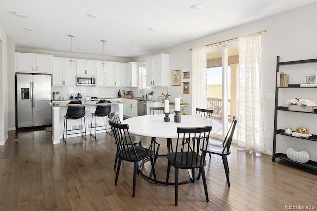 18992 W 84th Ave, Arvada, CO 80007 - dining area with dark wood finished floors and recessed lighting