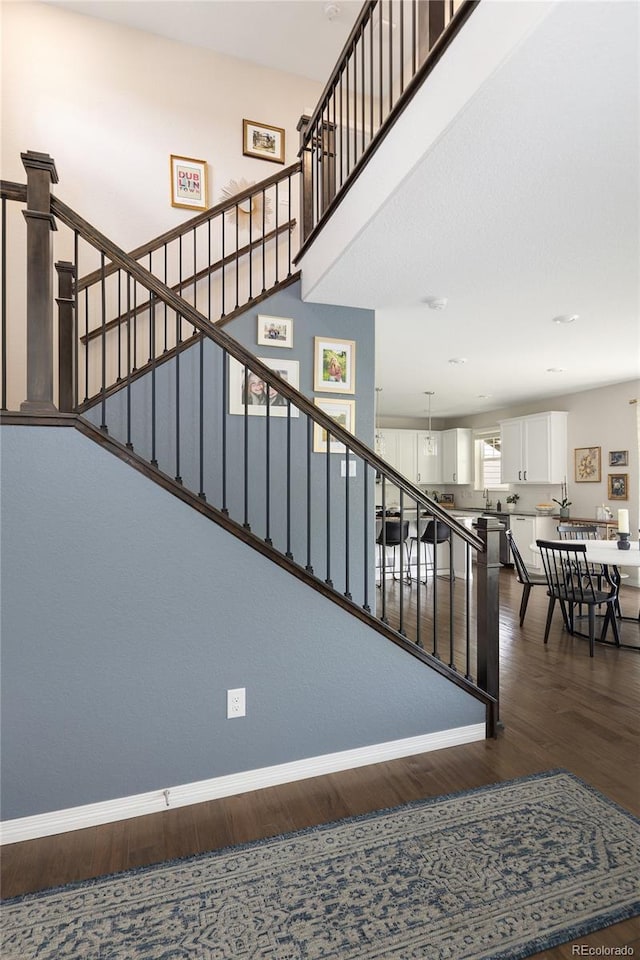18992 W 84th Ave, Arvada, CO 80007 - stairway featuring wood finished floors and baseboards