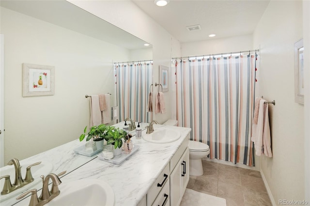 18992 W 84th Ave, Arvada, CO 80007 - full bath featuring double vanity, recessed lighting, tile patterned flooring, and a shower with shower curtain