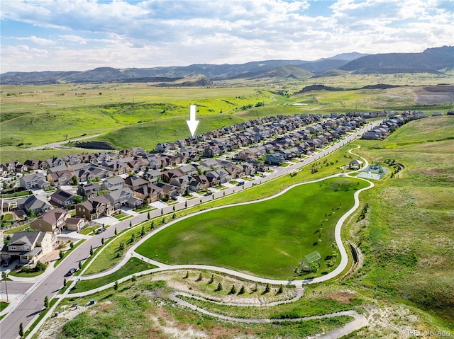 18992 W 84th Ave, Arvada, CO 80007 - aerial view of property and surrounding area featuring a mountainous background and nearby suburban area
