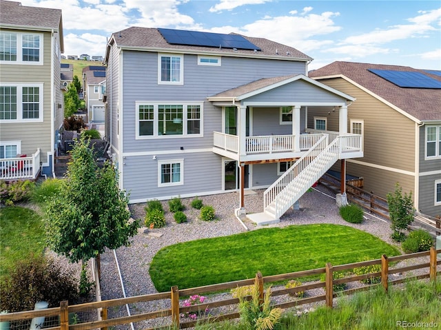 18992 W 84th Ave, Arvada, CO 80007 - rear view of property featuring a fenced backyard, a porch, and stairway