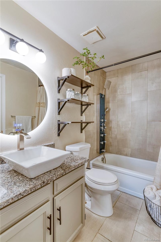 17595 E Mansfield Ave Unit 1331L, Aurora, CO 80013 - full bathroom featuring vanity, toilet, shower / tub combination, and tile patterned flooring