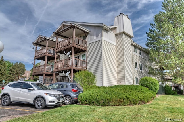 17595 E Mansfield Ave Unit 1331L, Aurora, CO 80013 - view of property with uncovered parking
