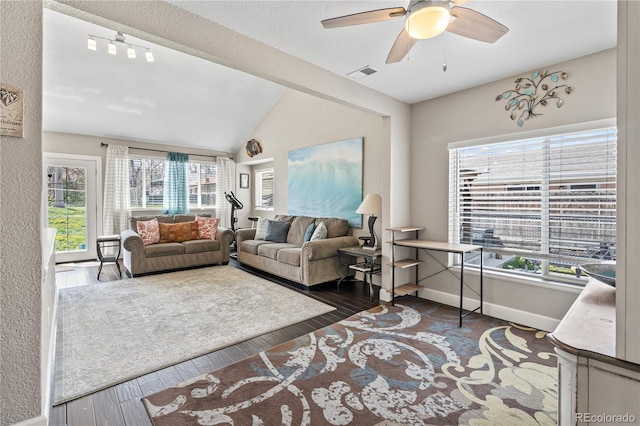 3625 Chase St, Wheat Ridge, CO 80212 - living area with vaulted ceiling, a ceiling fan, wood finished floors, and baseboards