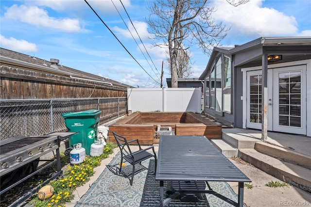 3625 Chase St, Wheat Ridge, CO 80212 - fenced backyard featuring french doors, outdoor dining area, a deck, and a patio area