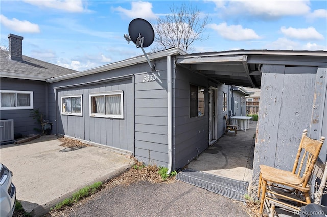3625 Chase St, Wheat Ridge, CO 80212 - view of side of property featuring a patio area and central air condition unit