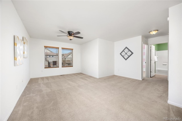 unfurnished living room with carpet floors and a ceiling fan